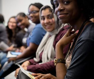 Close up on row of students in the audience.