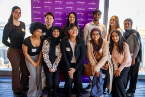 Marie Cari (left) with a group of Break Through Tech fellows at Accenture HQ in 2024.