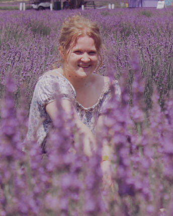 UIC computer science and linguistics major Grace Pnacek in a field of lavender flowers