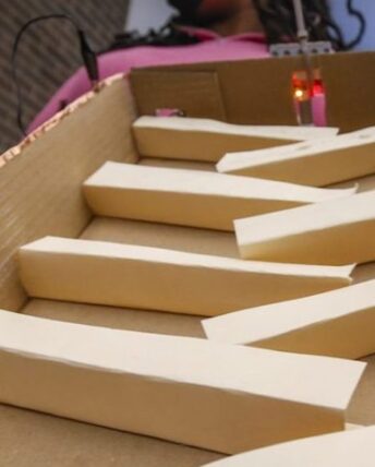 ladder-style wood blocks comprise one student's contribution to the Rube Goldberg project